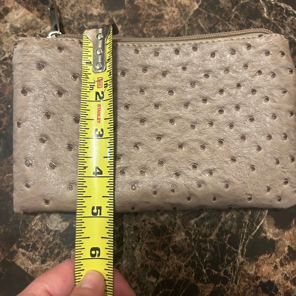 Beige Ostrich textured wristlet with polka dot lining
